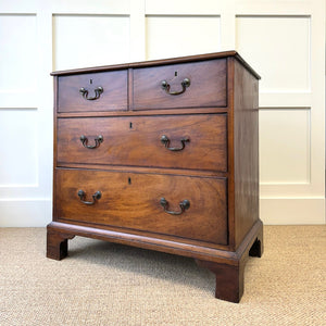 A English Georgian Chest of Drawers with Swan Neck Hardware