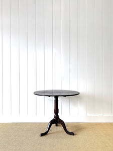 A George III Oak Circular Tilt-Top Tripod Tea Table