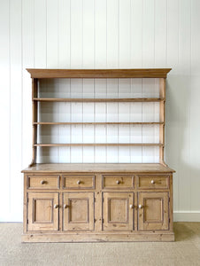 An Early 19th Century Monumental Pine Welsh Dresser or Cupboard
