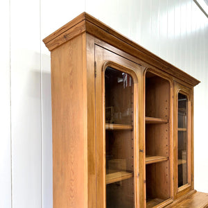 A 19th Century English Pine Bookcase Cabinet or Hutch with Arched Doors