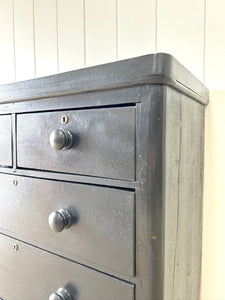 An Ebonized Antique English Chest of Drawers/Dresser