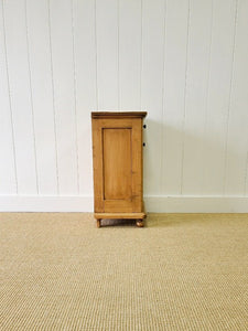 A Vintage Charming Pine Nightstand with Dark Knobs