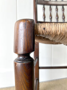 A Vintage Set of 6 English Oak Spindle Back Chairs with Rush Seats