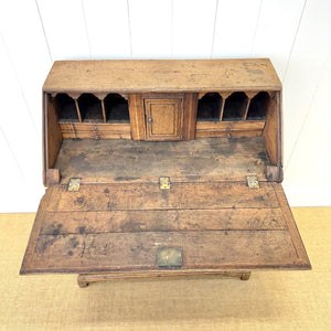 An Antique English Georgian Cumbrian Washed Oak Slant Front Desk