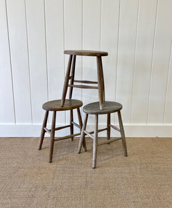 A Set of 3 Elm Splayed Leg Stools