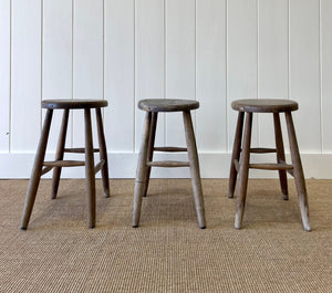 A Set of 3 Elm Splayed Leg Stools