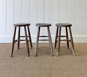 A Set of 3 Elm Splayed Leg Stools