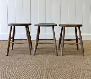 A Set of 3 Elm Splayed Leg Stools