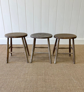 A Set of 3 Elm Splayed Leg Stools
