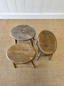 A Set of 3 Elm Splayed Leg Stools