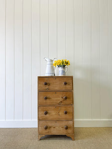 An Antique English Pine Narrow Chest of Drawers Dresser with Dark Wooden Knobs