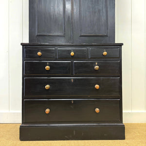 A 19th Century English Pine Ebonized Linen Press Cupboard