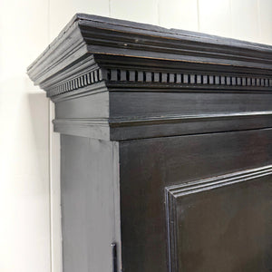 A 19th Century English Pine Ebonized Linen Press Cupboard