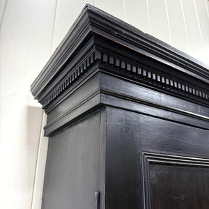 A 19th Century English Pine Ebonized Linen Press Cupboard