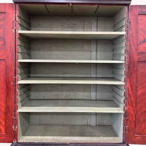 A 19th Century English Pine Ebonized Linen Press Cupboard