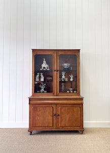 A 19th Century English Pine Bookcase with Glazed Top Doors