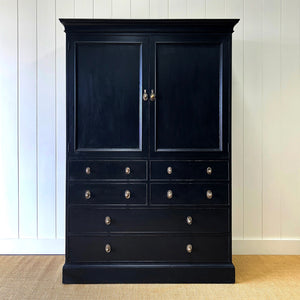 A Large 19th Century English Ebonized Linen Press Cupboard