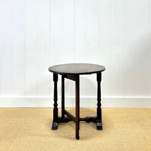 An Antique English Country Oak Coaching Gate Leg Table