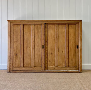 An English 19th Century Pitch Pine Sliding Door Bookcase