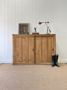 An English 19th Century Pitch Pine Sliding Door Bookcase
