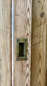 An English 19th Century Pitch Pine Sliding Door Bookcase