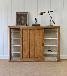 An English 19th Century Pitch Pine Sliding Door Bookcase