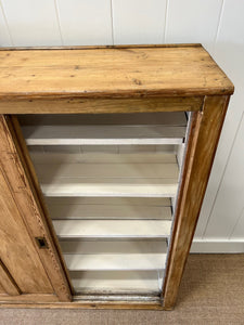 An English 19th Century Pitch Pine Sliding Door Bookcase