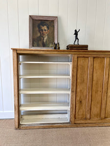 An English 19th Century Pitch Pine Sliding Door Bookcase