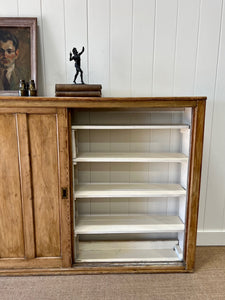 An English 19th Century Pitch Pine Sliding Door Bookcase
