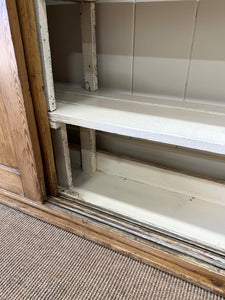 An English 19th Century Pitch Pine Sliding Door Bookcase