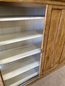 An English 19th Century Pitch Pine Sliding Door Bookcase
