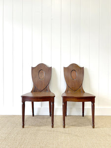 A Pair of Regency Fluted Leg Hall Chairs