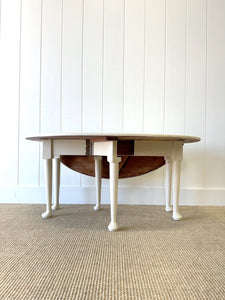 An Antique Pine Oval Drop Leaf Coffee Table