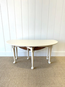 An Antique Pine Oval Drop Leaf Coffee Table