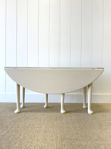 An Antique Pine Oval Drop Leaf Coffee Table