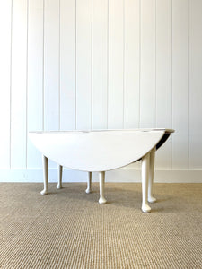 An Antique Pine Oval Drop Leaf Coffee Table