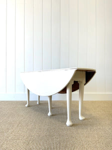 An Antique Pine Oval Drop Leaf Coffee Table