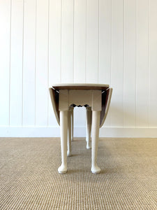 An Antique Pine Oval Drop Leaf Coffee Table