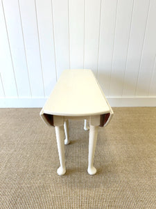 An Antique Pine Oval Drop Leaf Coffee Table