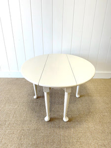 An Antique Pine Oval Drop Leaf Coffee Table