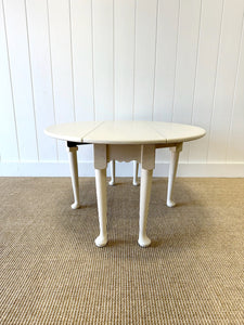 An Antique Pine Oval Drop Leaf Coffee Table