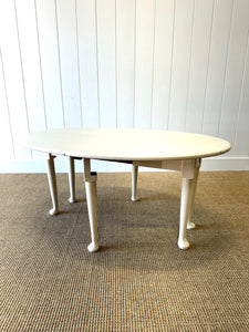 An Antique Pine Oval Drop Leaf Coffee Table
