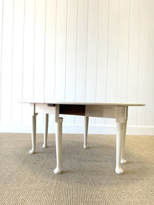 An Antique Pine Oval Drop Leaf Coffee Table