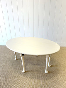 An Antique Pine Oval Drop Leaf Coffee Table