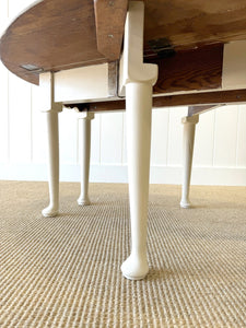 An Antique Pine Oval Drop Leaf Coffee Table