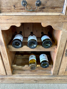 An Early 19th century Rustic Pine Welsh Dresser or Cupboard with Brass Hardware