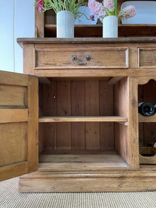 An Early 19th century Rustic Pine Welsh Dresser or Cupboard with Brass Hardware