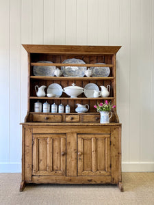 An Early 19th Century Pine Irish Dresser or Cupboard with Wooden Knobs