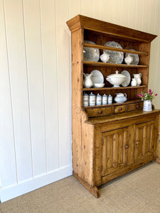 An Early 19th Century Pine Irish Dresser or Cupboard with Wooden Knobs