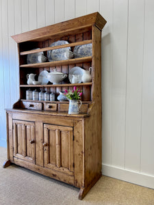 An Early 19th Century Pine Irish Dresser or Cupboard with Wooden Knobs